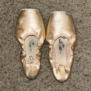 Well worn, pointe shoes. No use for them anymore